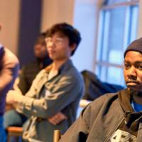 International Anchor Allies Winter 2026 First Mixer - students focused on the ongoing presentation